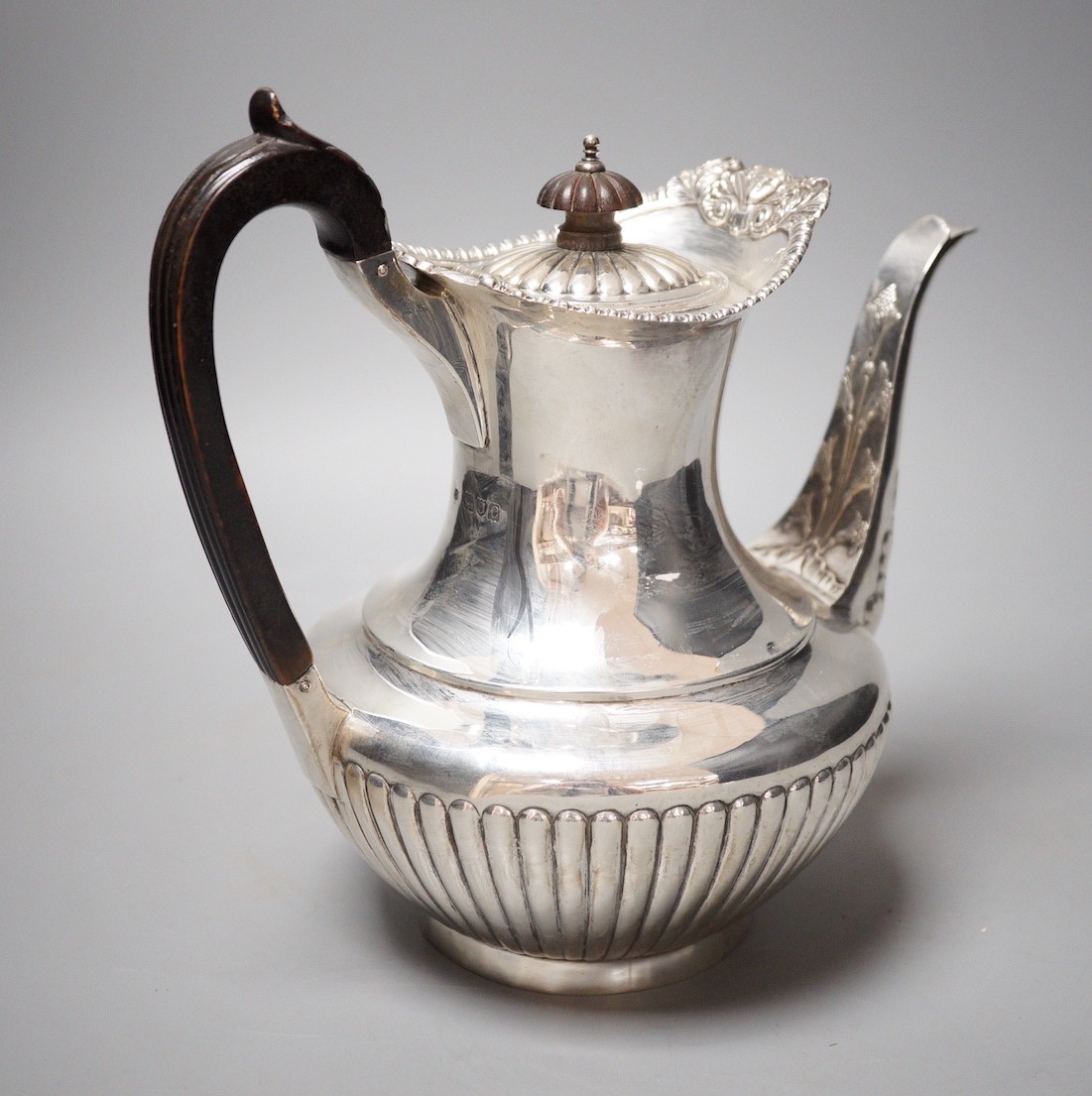 A late Victorian demi-fluted silver coffee pot, Gibson & Langman (Goldsmiths & Silversmiths Co Ltd), London, 1898, height 22.8cm